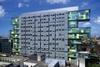 Judges’ offices on the west elevation are veiled by a perforated screen in grey-painted metal.