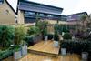 Townhouse garden, looking onto detached house.