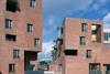 The two buildings frame a narrow entrance to the yard on Cork Street.