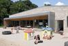 The nursery-level classrooms open onto a zinc covered terrace.