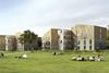 Each pair of student accommodation buildings is linked by a staircase and walkway structure that creates a courtyard area.