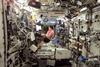 NASA astronaut Edward Lu plays a musical keyboard inside the US laboratory module Destiny in October 2003.