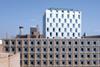 The lower brick block with the aluminium-clad tower behind in Southwark, south London.