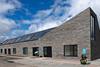 The Stone House, Nord Architecture. The terrace of four family-sized houses is characterised by its outer skin of riven Caithness stone.