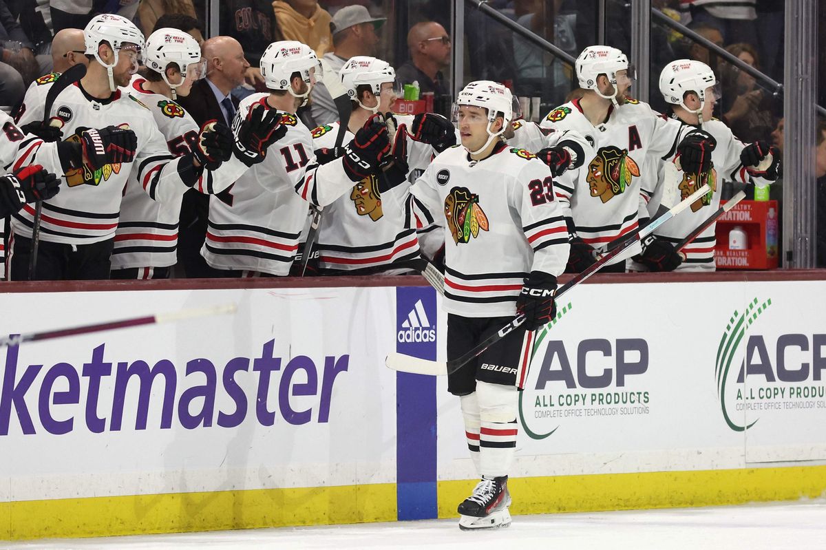 TEMPE, ARIZONA - MARCH 05: Philipp Kurashev #23 of the Chicago Blackhawks celebrates with teammates on the bench after scoring a power-play goal against the Arizona Coyotes during the second period of the NHL game at Mullett Arena on March 05, 2024 in Tempe, Arizona.   Christian Petersen/Getty Images/AFP (Photo by Christian Petersen / GETTY IMAGES NORTH AMERICA / Getty Images via AFP)