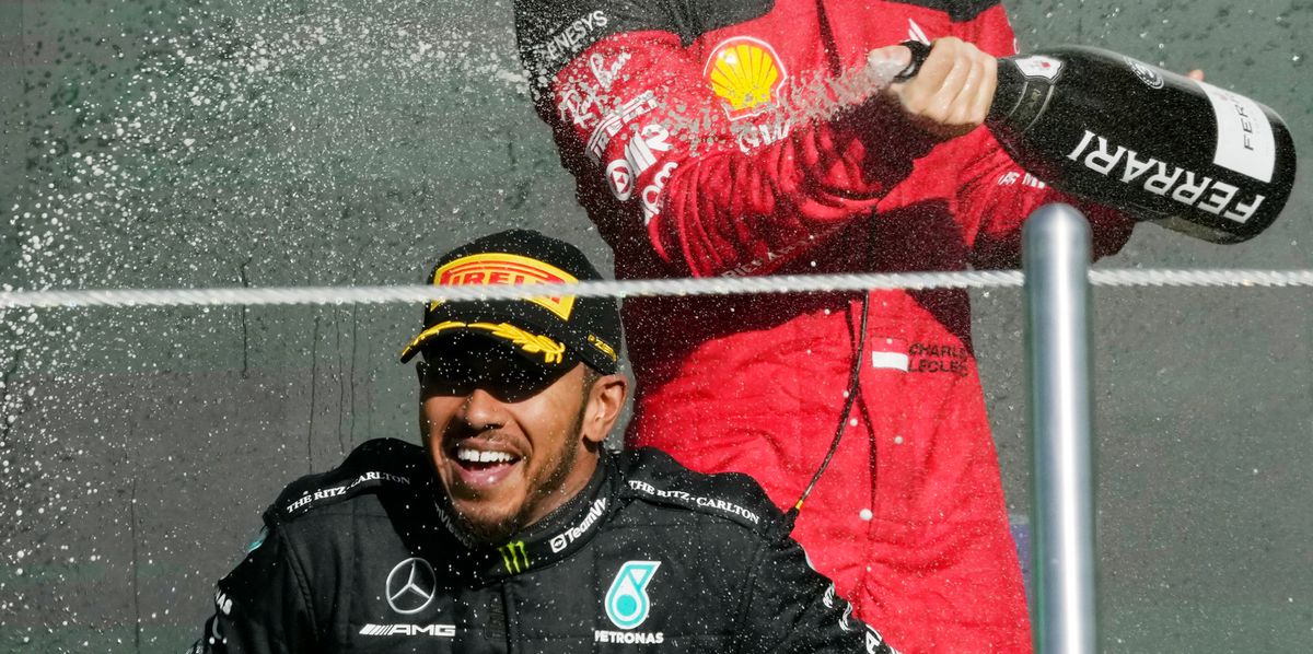FILE - second placed Mercedes driver Lewis Hamilton of Britain, bottom, is sprayed with champagne by third placed Ferrari driver Charles Leclerc of Monaco on the podium for the Formula One Mexico Grand Prix auto race at the Hermanos Rodriguez racetrack in Mexico City, Sunday, Oct. 29, 2023. Seven-time Formula One champion Lewis Hamilton has been linked with a shock move from Mercedes to Ferrari next year.  (AP Photo/Fernando Llano, File)
