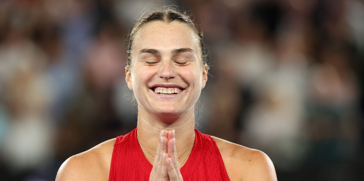 MELBOURNE, AUSTRALIA - JANUARY 27: Aryna Sabalenka celebrates winning championship point during their Women's Singles Final match against Qinwen Zheng of China during the 2024 Australian Open at Melbourne Park on January 27, 2024 in Melbourne, Australia. (Photo by Darrian Traynor/Getty Images)