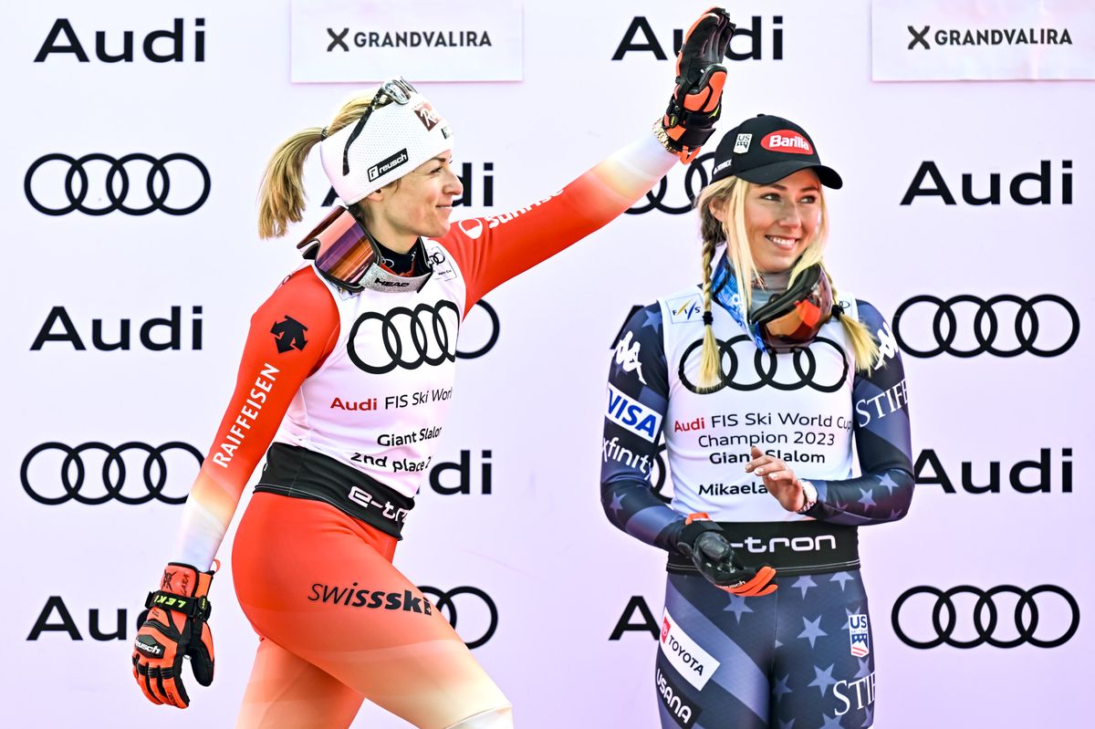 Second placed of the women's giant slalom overall classification Lara Gut-Behrami of Switzerland celebrates next to Mikaela Shiffrin of the United States during the podium ceremony at the FIS Alpine Skiing World Cup finals in Soldeu, Andorra, Sunday, March 19, 2023. (KEYSTONE/Jean-Christophe Bott)