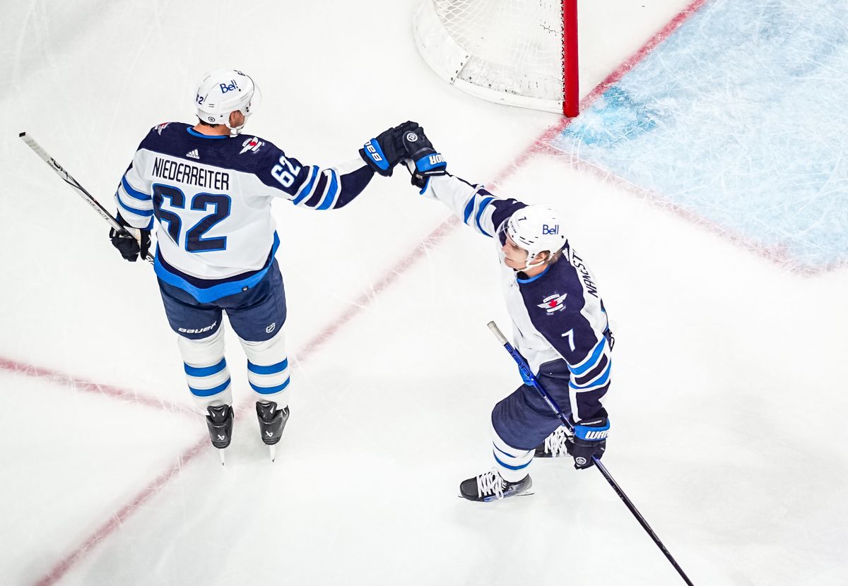 RALEIGH, NORTH CAROLINA - MARCH 02: Nino Niederreiter #62 of the Winnipeg Jets celebrates with teammates after a goal during the third period against the Carolina Hurricanes at PNC Arena on March 02, 2024 in Raleigh, North Carolina. (Photo by Josh Lavallee/NHLI via Getty Images)