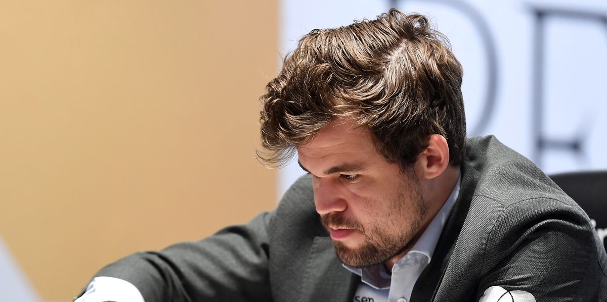 epa09633984 Defending Champion Magnus Carlsen of Norway plays against Ian Nepomniachtchi (not pictured) of Russia during the 11th round of FIDE World Chess Championship at the EXPO 2020 Dubai in Dubai, United Arab Emirates, 10 December 2021.  EPA/YOSHUA ARIAS