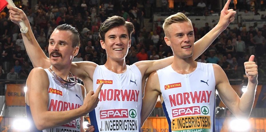(L-R) Norway's Henrik Ingebrigtsen, Norway's Jakob Ingebrigtsen and Norway's Filip Ingebrigtsen celebrate after the men's 1500m final race during the European Athletics Championships at the Olympic stadium in Berlin on August 10, 2018. (Photo by Andrej ISAKOVIC / AFP)